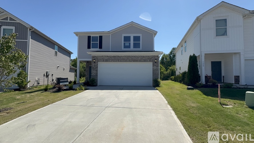 A house with a garage is available for sale.