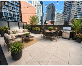 A patio with a table, chairs, and potted plants.
