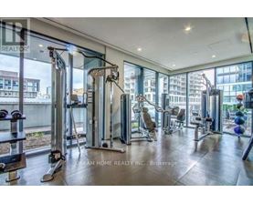 A gym with a view of the city outside the windows.