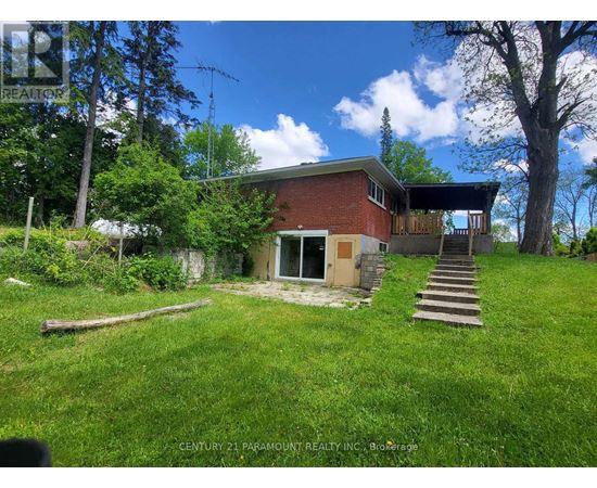 A house with a lawn in front of it.