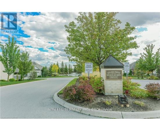 A sign in front of a house reads "STREET REAL ESTATE AGENTS".