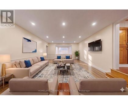 A spacious living room with a large sectional sofa and a coffee table.