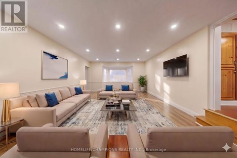 A spacious living room with a large sectional sofa and a coffee table.