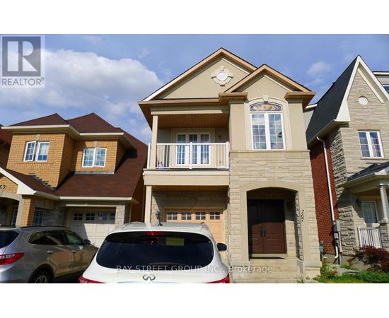 A white car is parked in front of a house with a sign that says "Bay Street Group".