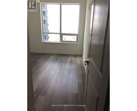 A room with a window and a door.