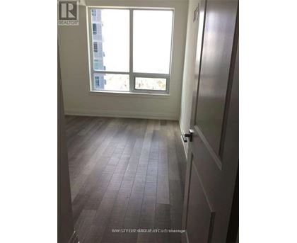 A room with a window and a door.