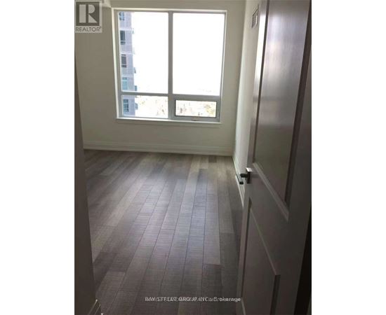 A room with a window and a door.