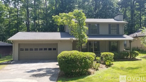 A house with a garage is for sale.