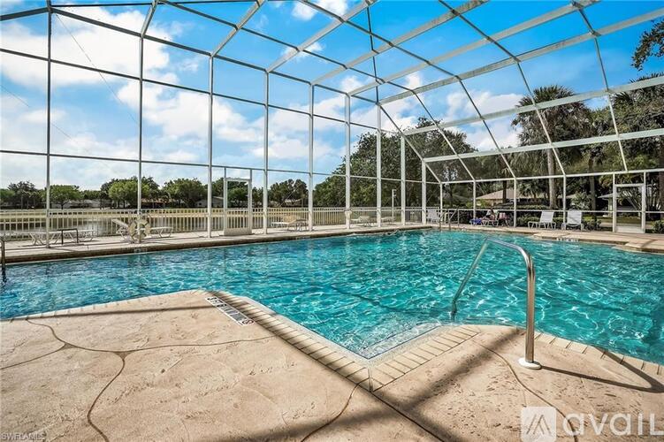 A pool enclosed by a glass wall.