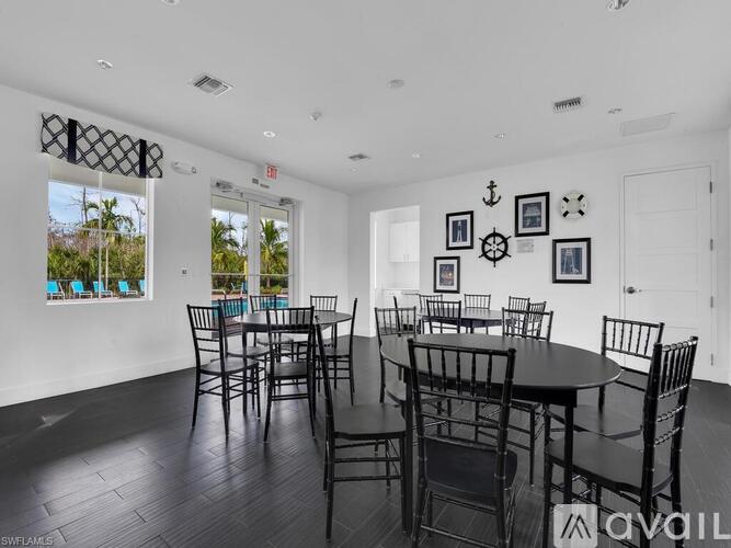 A dining room with a table set for six.