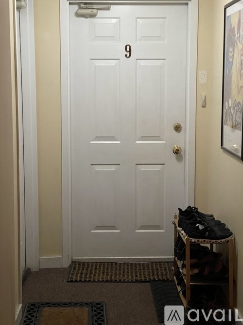 A white door with the number 9 on it.