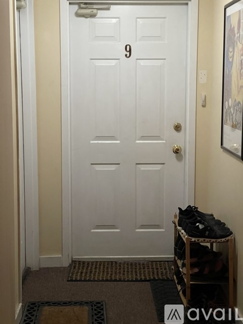 A white door with the number 9 on it.