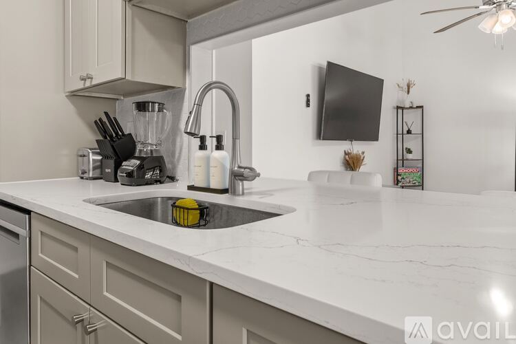 A kitchen with a sink and a countertop.