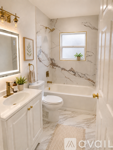 A bathroom with a marble floor and white walls.