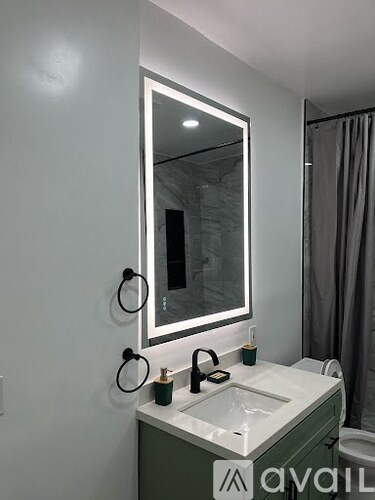 A bathroom with a sink and mirror.