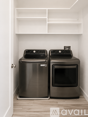 Two stainless steel ovens in a kitchen.