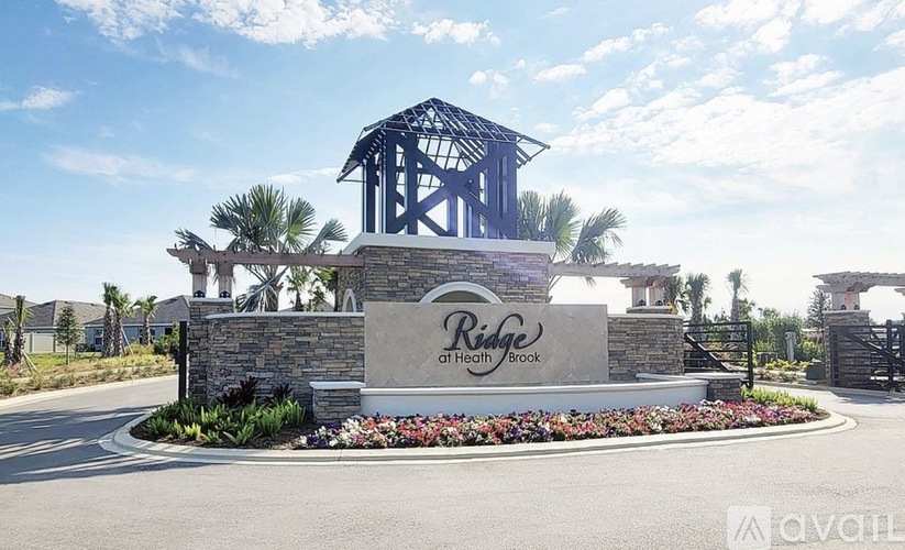 The entrance to Ridge at Health Brook is surrounded by a beautiful garden.