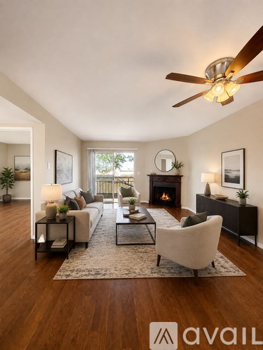 A living room with a fireplace and a chair.