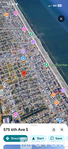 A map application is open, showing a street view of a beachfront area with various colored markers indicating locations or points of interest.