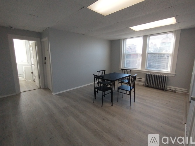 A room with a table and chairs in it.