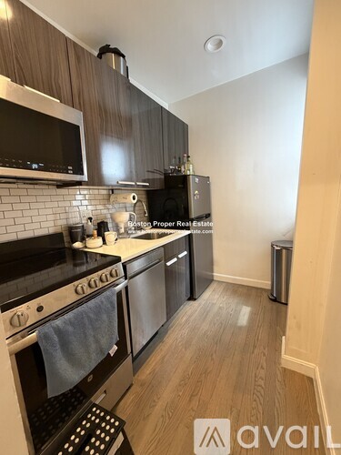 A kitchen with a stove top oven and a microwave.