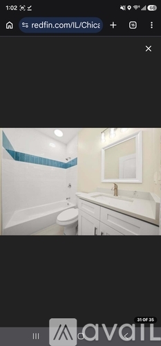 A bathroom with a toilet, sink, and bathtub.