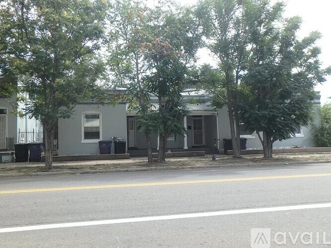 A house with a tree in front of it.