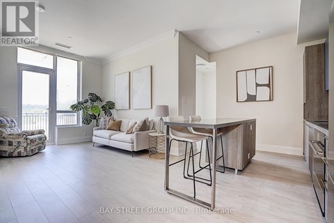 A spacious living room with a dining table and chairs.