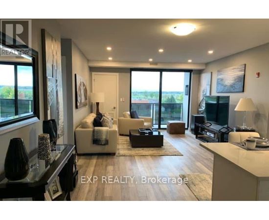 A well-lit, modern living room with a large window and a view of the outdoors.