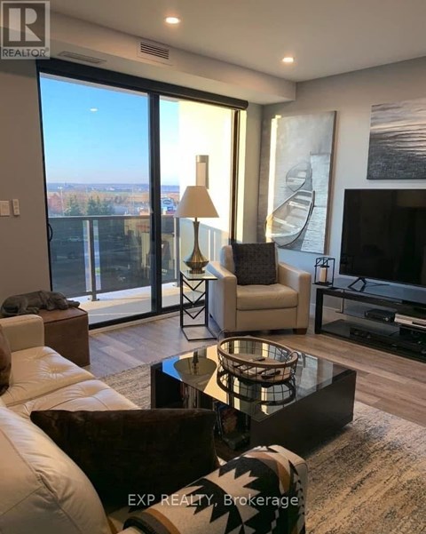 A living room with a glass table and a white sofa.