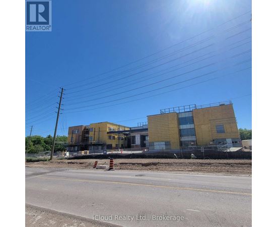A building under construction with a clear blue sky above.