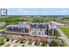 A bird's eye view of a residential area with apartment buildings and houses.
