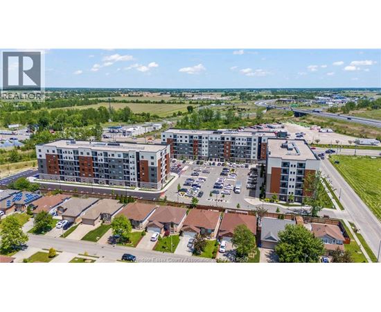 A bird's eye view of a residential area with apartment buildings and houses.