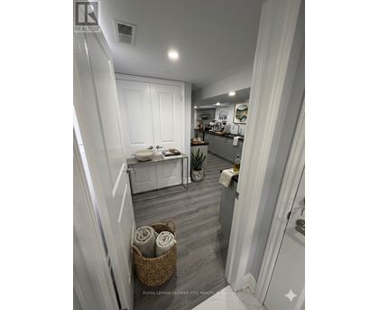 A bathroom with a white toilet and a white sink.