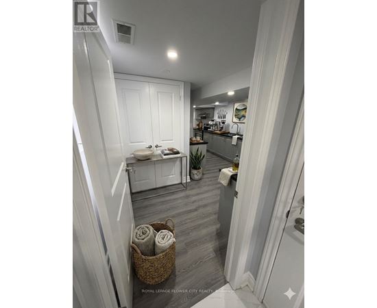 A bathroom with a white toilet and a white sink.