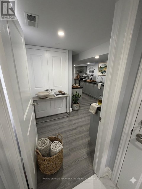 A bathroom with a white toilet and a white sink.