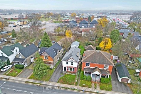 A suburban neighborhood with houses and trees.
