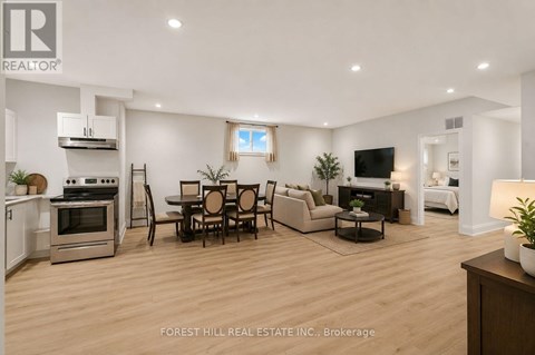 A modern living room with a dining table and chairs.