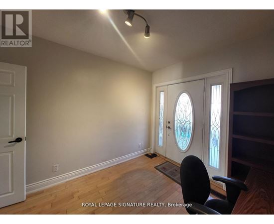 A room with a door and a window with a white frame.
