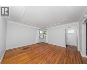 A room with wooden floors and white walls.
