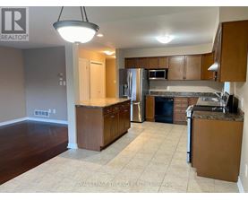 A kitchen with brown cabinets and a countertop.