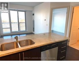 A kitchen with a sink and a dishwasher.