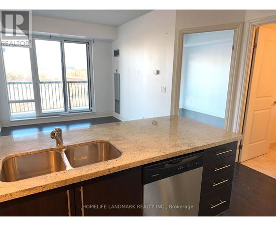 A kitchen with a sink and a dishwasher.