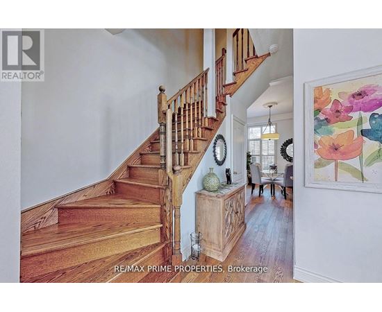 A staircase with a wooden banister and steps.