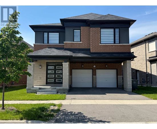 A two-story house with a garage and a brick facade.