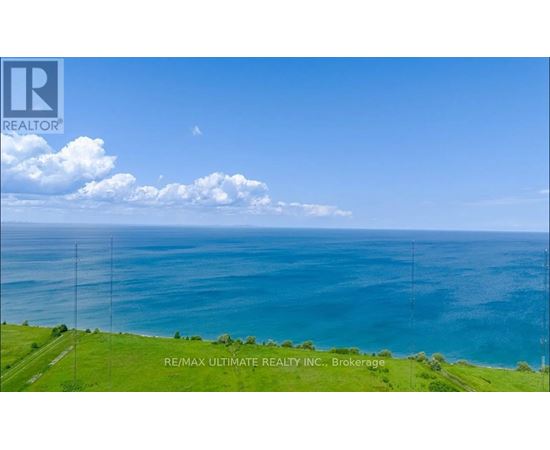 A real estate company logo is displayed on a scenic coastal background.