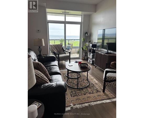 A living room with a view of the ocean.