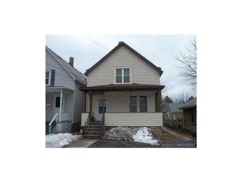 A house with a brown roof and a white door.