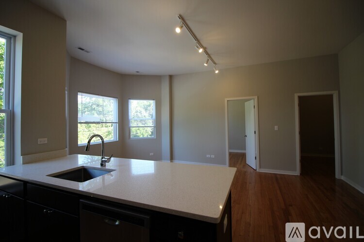 A kitchen with a sink and a window.