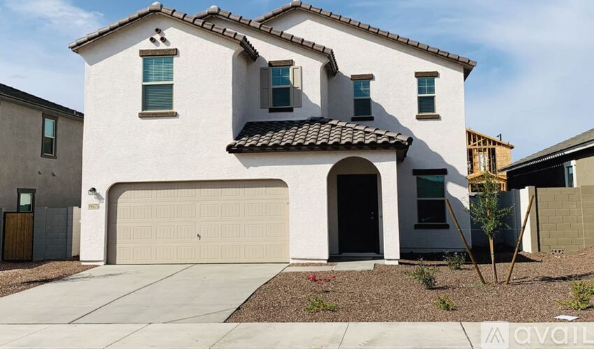 A modern house with a garage is for sale.